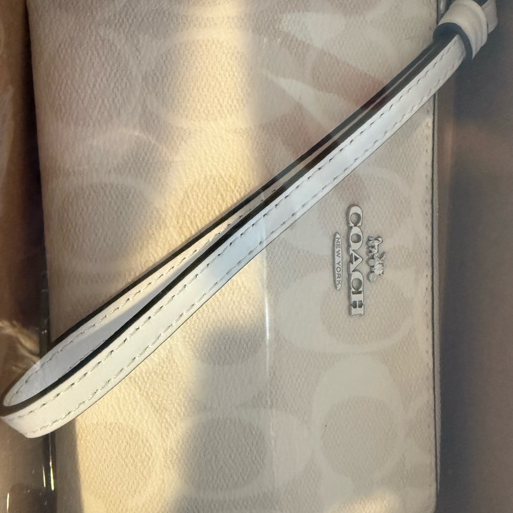 Coach Light Beige Wristlet with White Strap